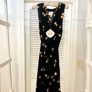 Tie waist, button detail dress with asymmetrical hem line. NWT.